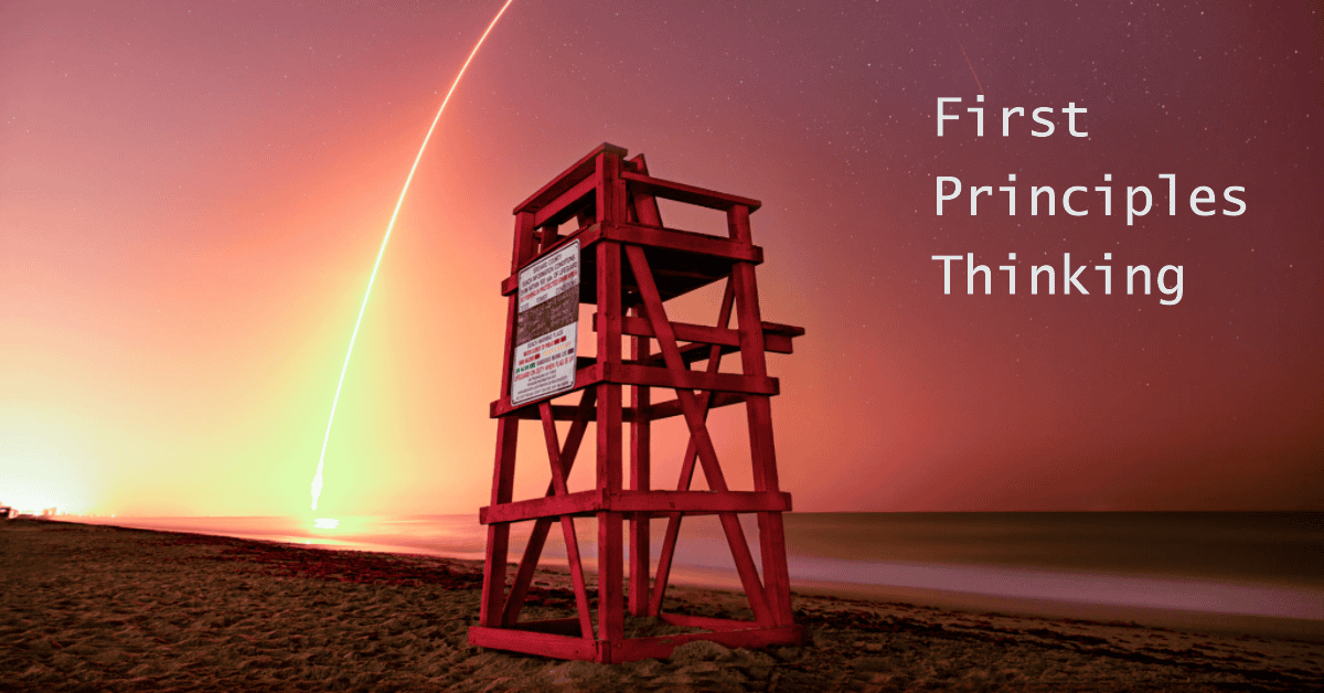 Lifeguard tower on a beach with the glow of a rocket launch in the sky behind it