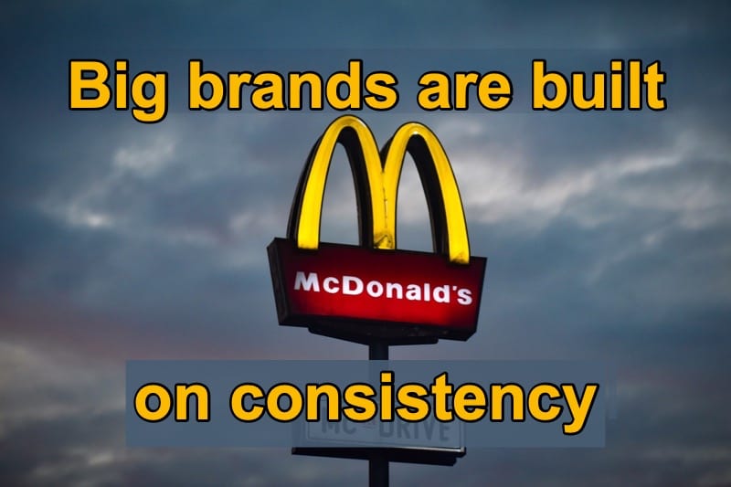 Image of a McDonalds sign with a cloudy sky in the background